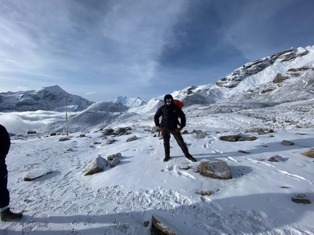 Trekker with guide in Himalayas